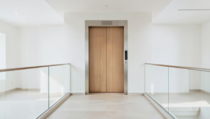 Contemporary home elevator with warm wood doors and brushed metal trim
