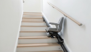 AI-generated conceptual illustration of a rail-mounted stairlift chair on a straight indoor staircase.